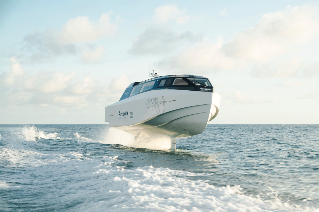 White boat foiling above water