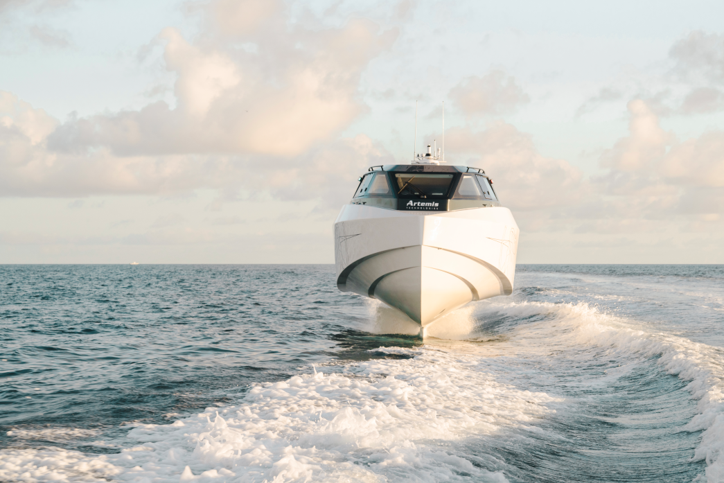 White boat foiling above water