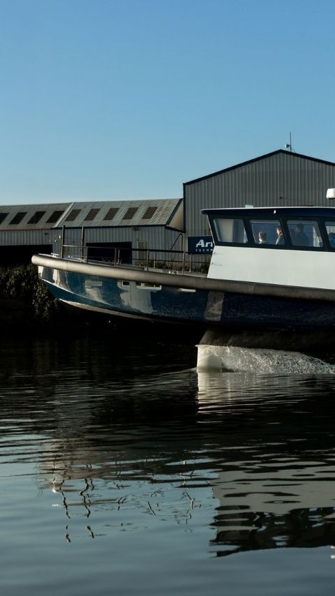 Close up of the Artemis EF-12 Workboat XL foiling