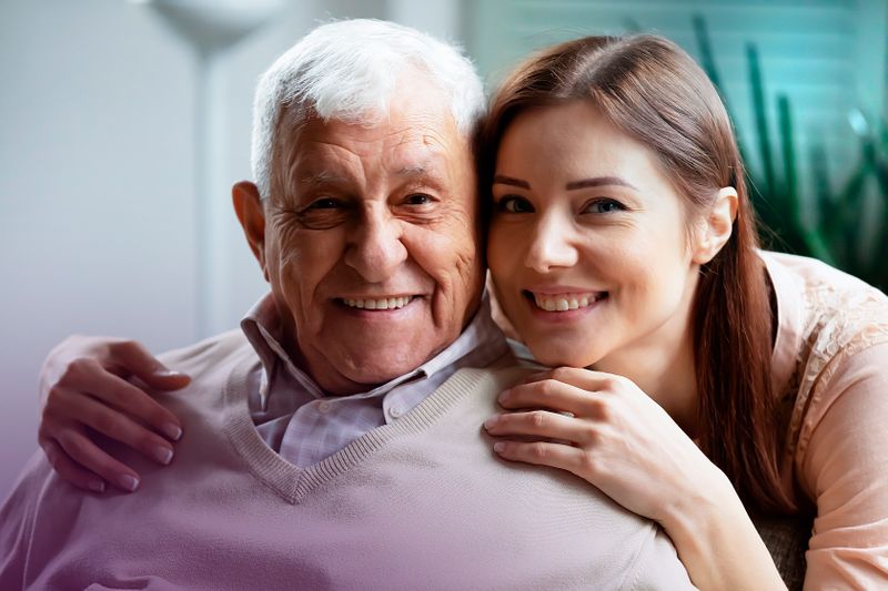Woman Buying Funeral Plan With Grandfather