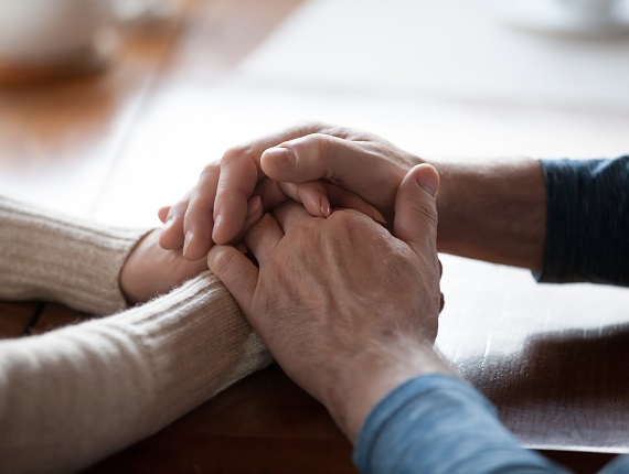 Two People Holding Hands