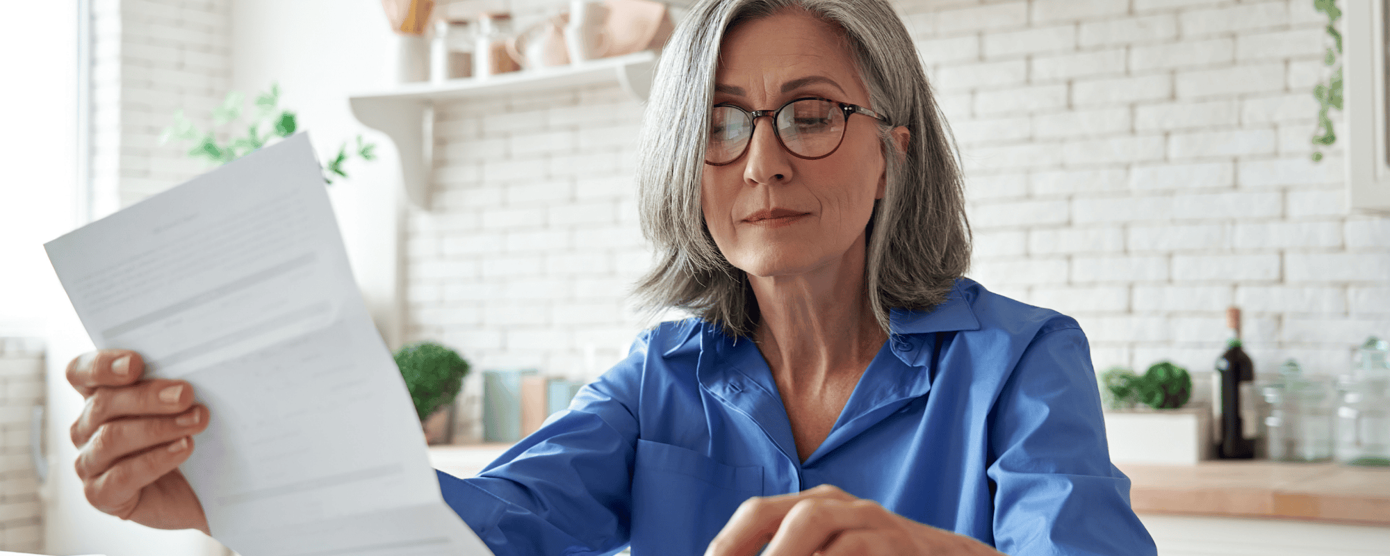 Woman Calculating Cost of Funeral
