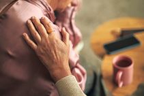 Comforting Hand On Shoulder