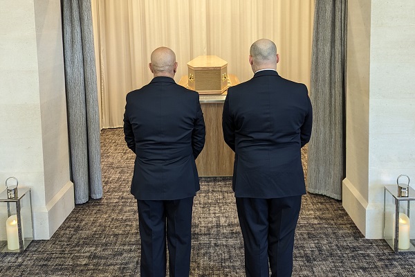 Funeral Attendants In Front Of Coffin At Paupers Funeral