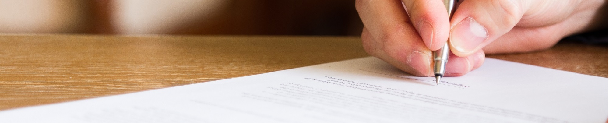 Man Filling Out Funeral Plan Form