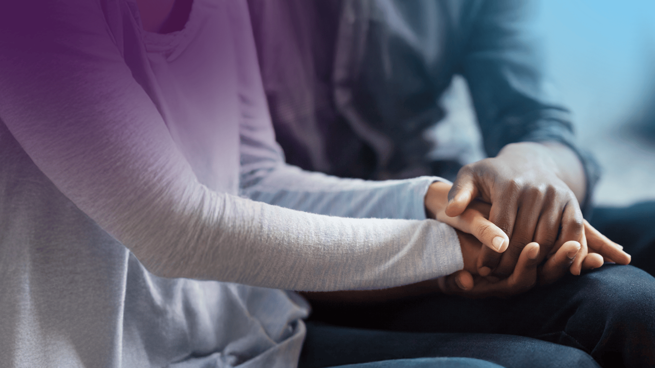 Couple Holding Hands In Lap