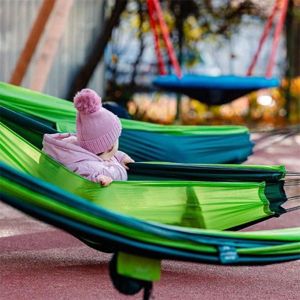 Image of child in an outdoor hammock at the sensory park in at the Prof. Dr. Alexandru Obregia Psychiatric Hospital in Bucharest 