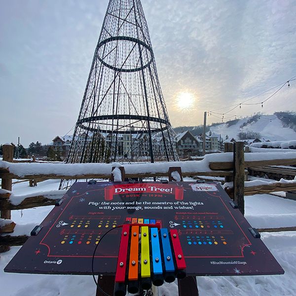 Garland Filled Blue Mountain Village includes Outdoor Musical Instruments along its Spectacular Lights Trail