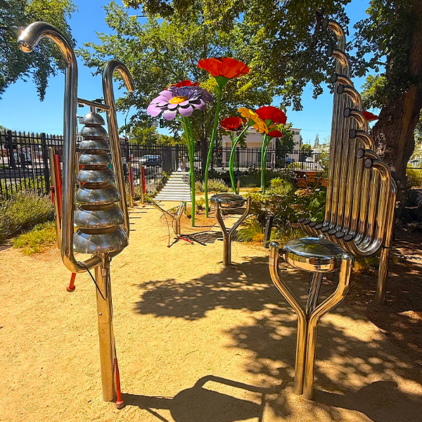 a collection of large outdoor musical instruments in a childrens museums music garden