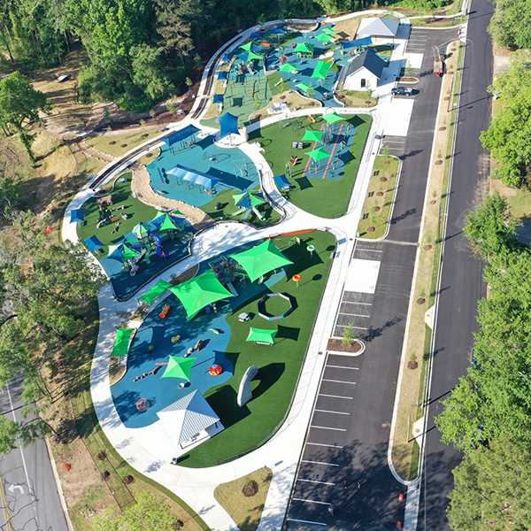 a birds eye view of a large inclusive play park in auburn