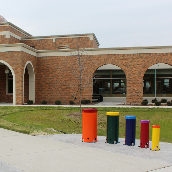 a set of five outdoor musical drums outside the Clinton Macomb Library