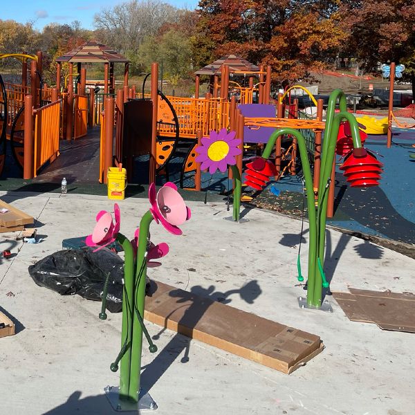St Croix installation team creating an outdoor playground with outdoor musical instruments