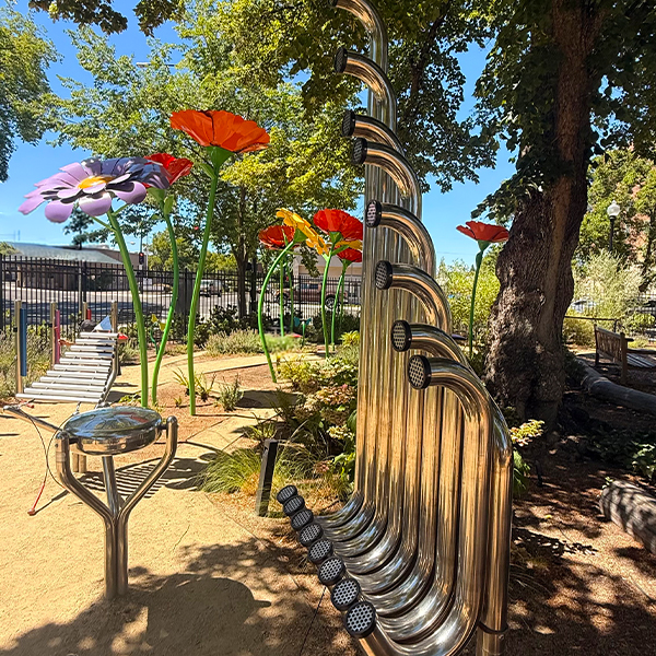 a collection of large outdoor musical instruments in a childrens museums music garden