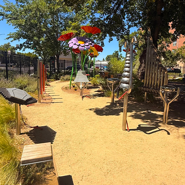 a collection of outdoor musical instruments in a childrens museums music garden