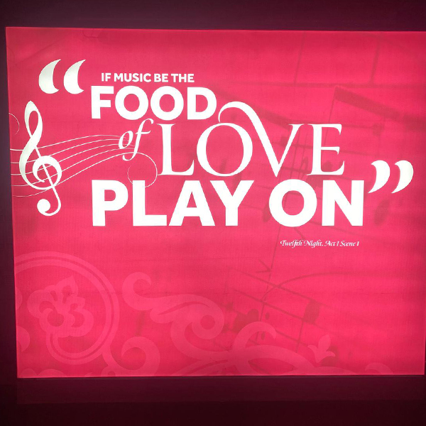 neon sign with Shakespeare quote If music be the food of love play on