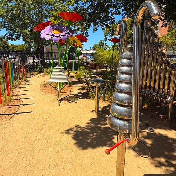 a collection of outdoor musical instruments in a childrens museums music garden