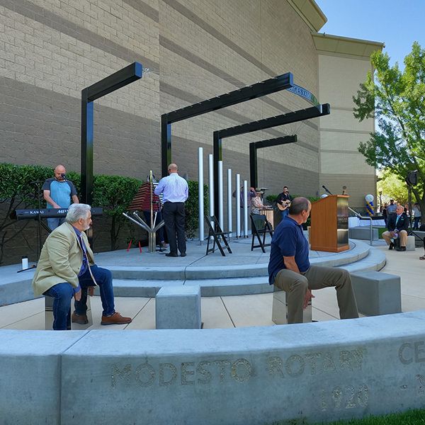 musicians playing outdoor musical instruments at the opening ceremony of the Modesto Gallo Center's new outdoor music garden